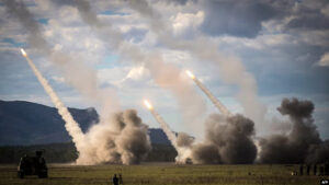 Missiles launch from a U.S military HIMARS during drills in Shoalwater Bay, Australia, July 22, 2023. The U.S. has announced nearly $1 billion more in military aid to Ukraine. The aid package includes ammunition for HIMARS rocket launchers.