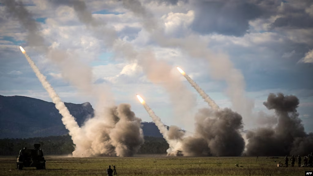 Missiles launch from a U.S military HIMARS during drills in Shoalwater Bay, Australia, July 22, 2023. The U.S. has announced nearly $1 billion more in military aid to Ukraine. The aid package includes ammunition for HIMARS rocket launchers.